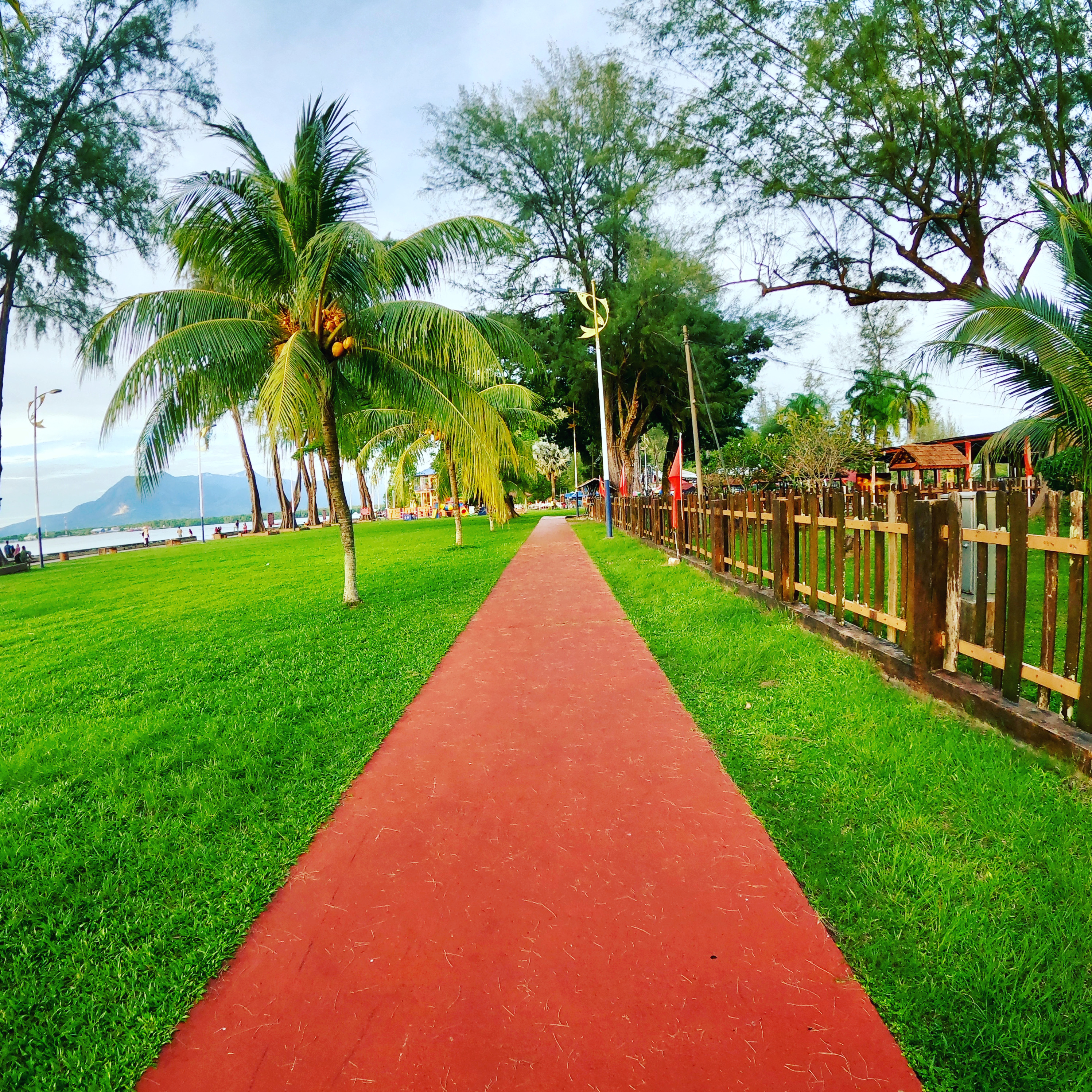 Ombak kecil menyentuh garis pasir Pantai Merdeka